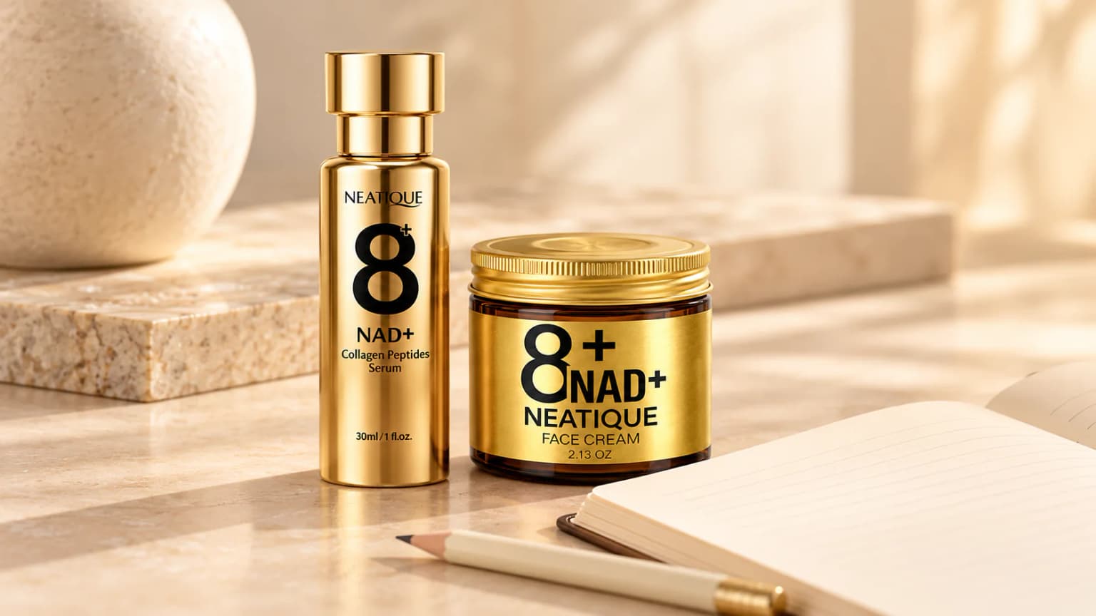 Neatique NAD+ Serum and Face Cream beside a blank notebook for planning skincare layers