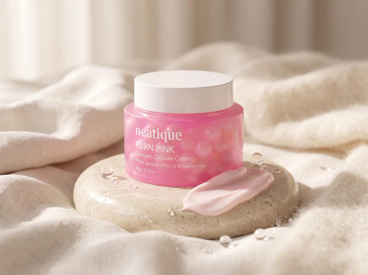 Neatique PDRN cream with a rich cream ribbon in a soft barrier-comfort routine setting.