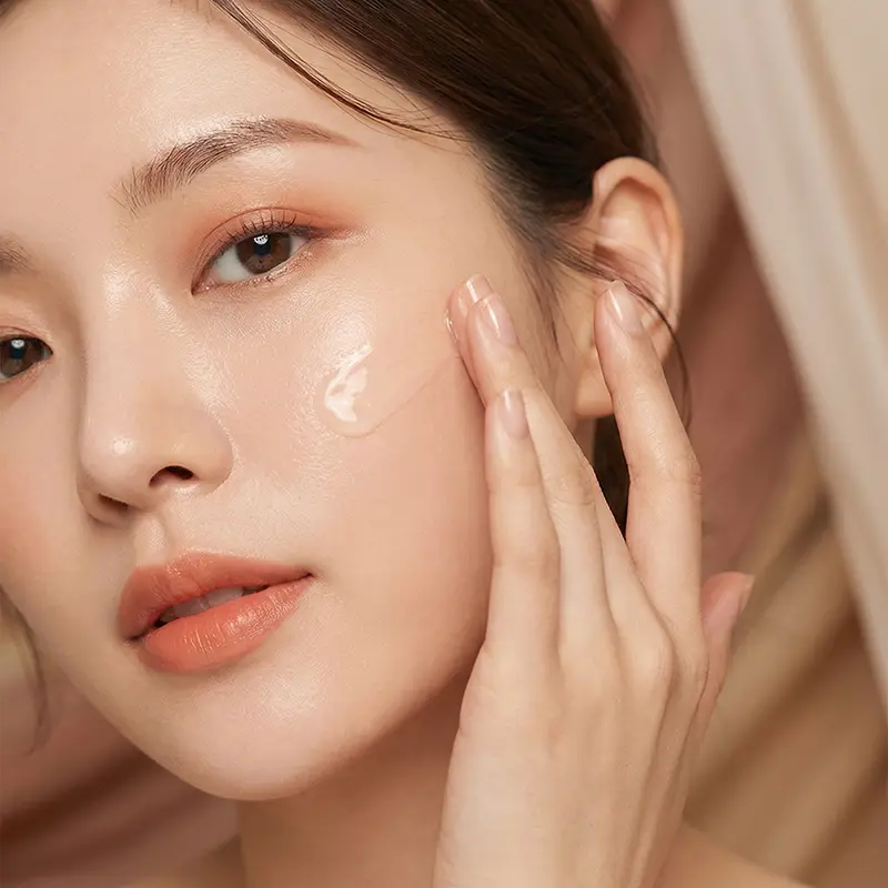 Close-up of Neatique skincare application for a soft, hydrated finish.